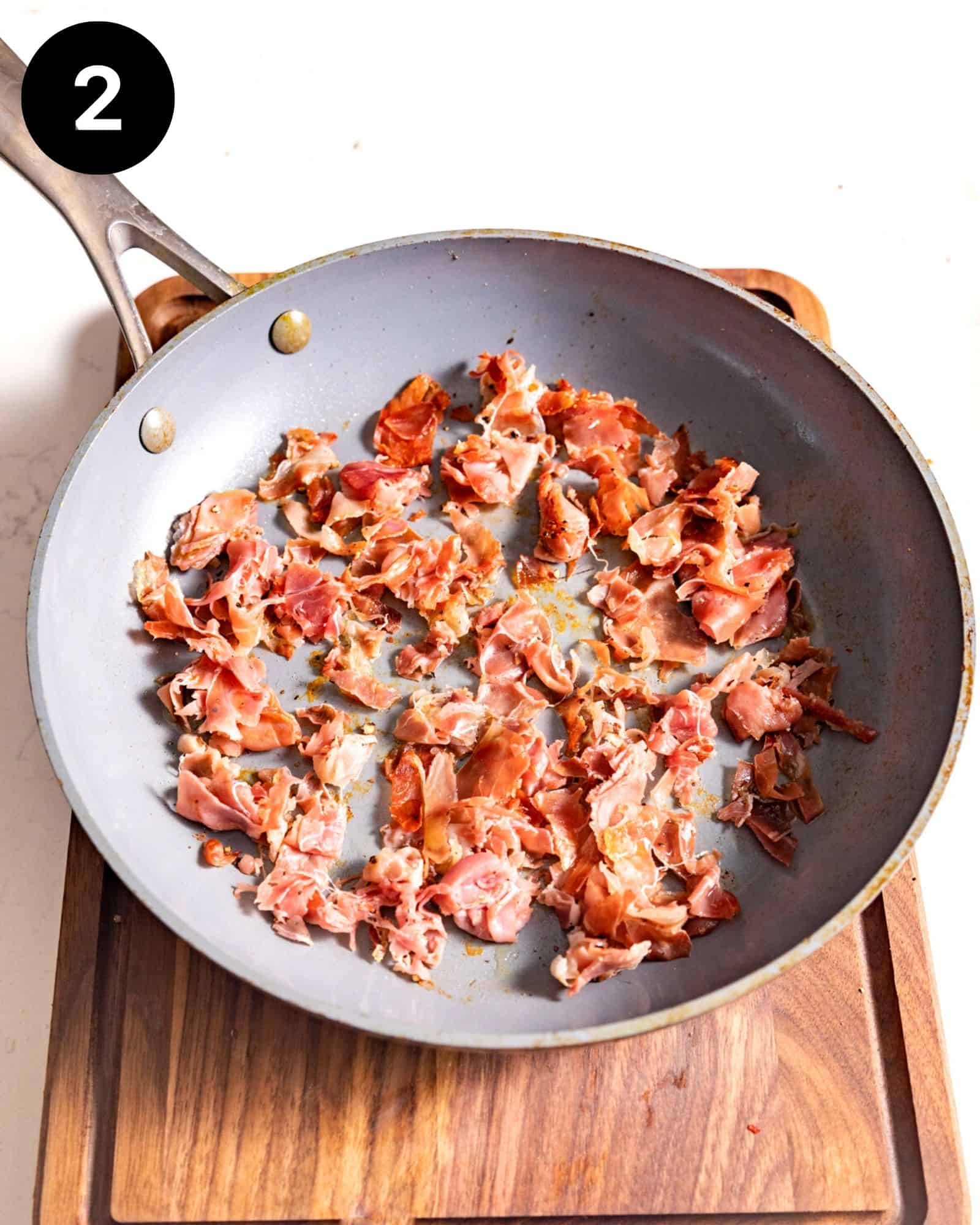 crispy prosciutto in a frying pan.
