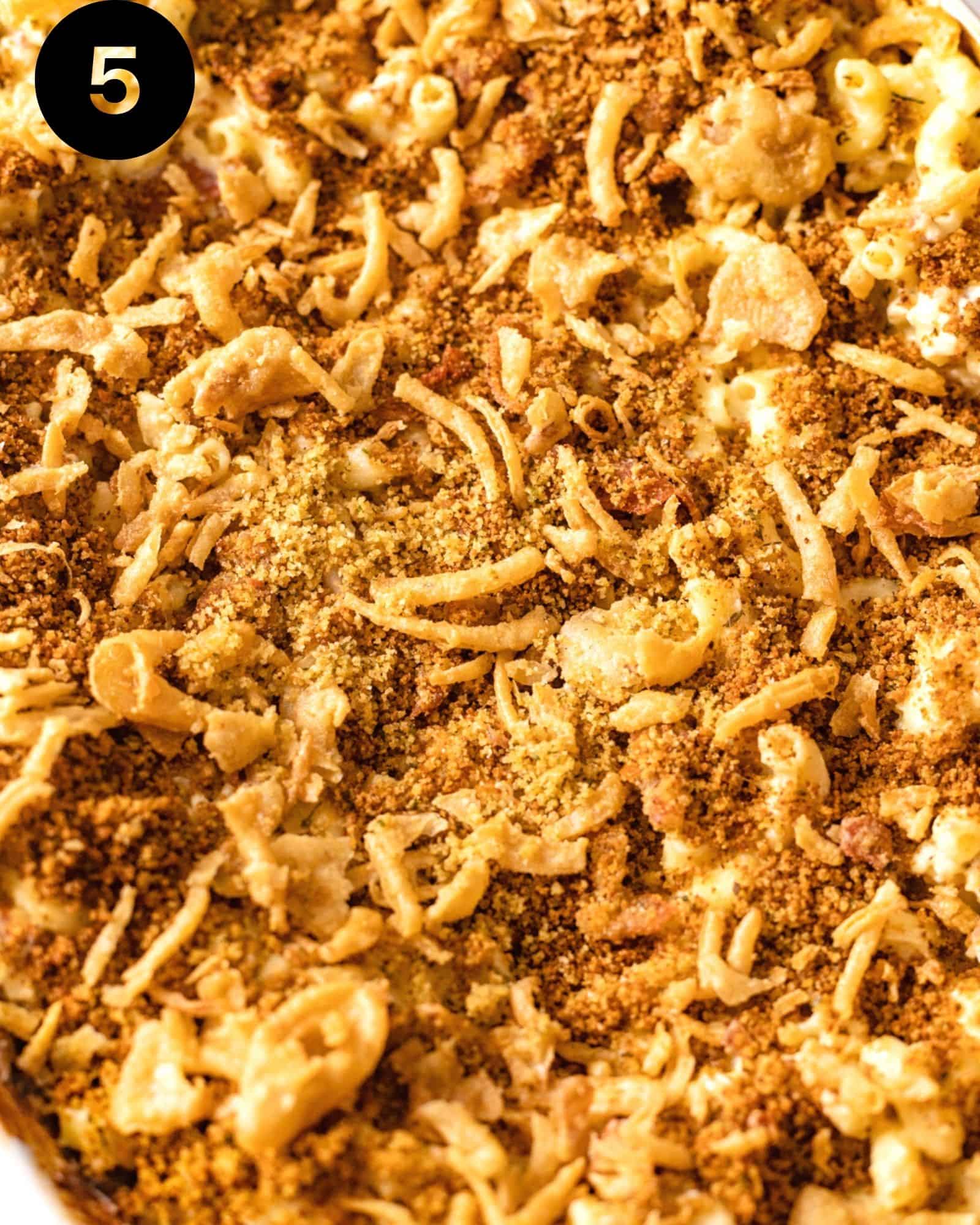 up close photo of breadcrumb topping with crispy french onions on top of macaroni and cheese.