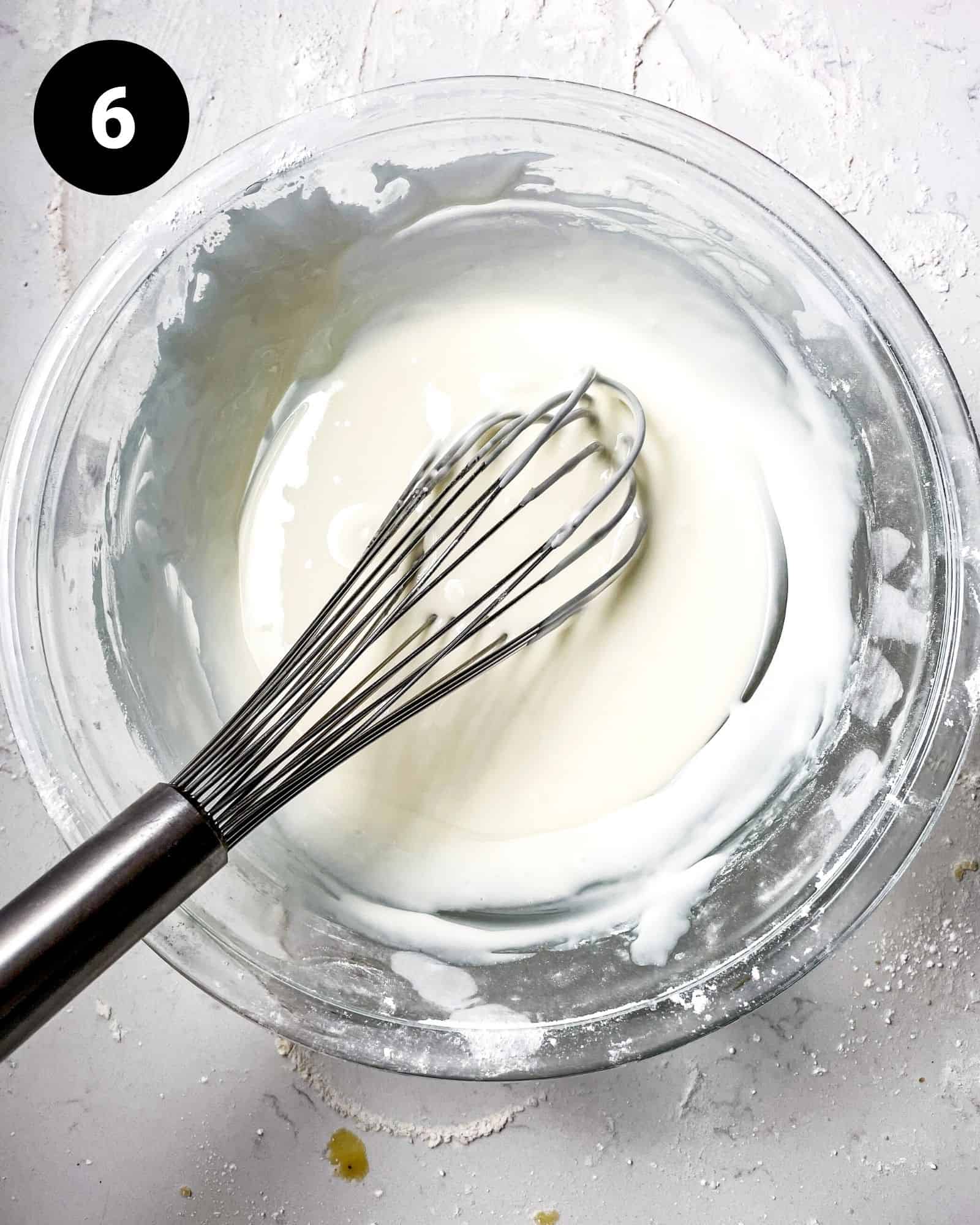 royal icing whisked together in a mixing bowl.