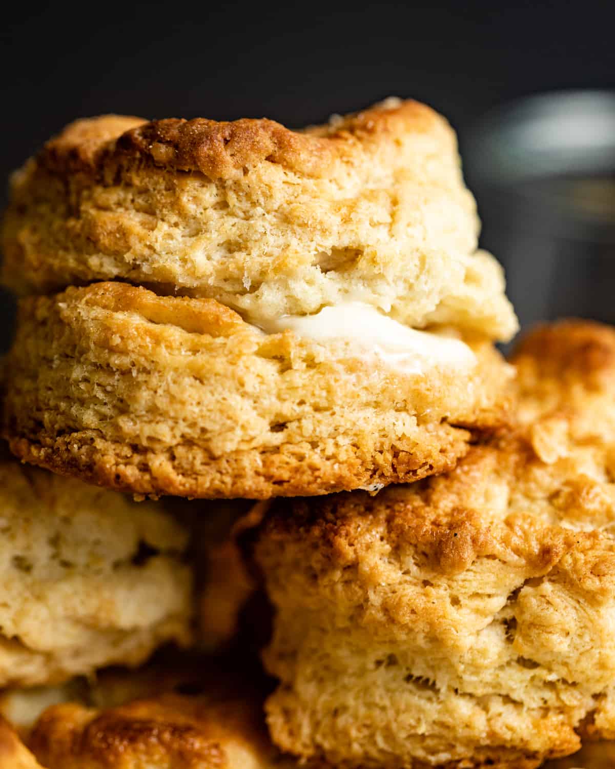 up close photo of biscuits with melted butter in the middle.