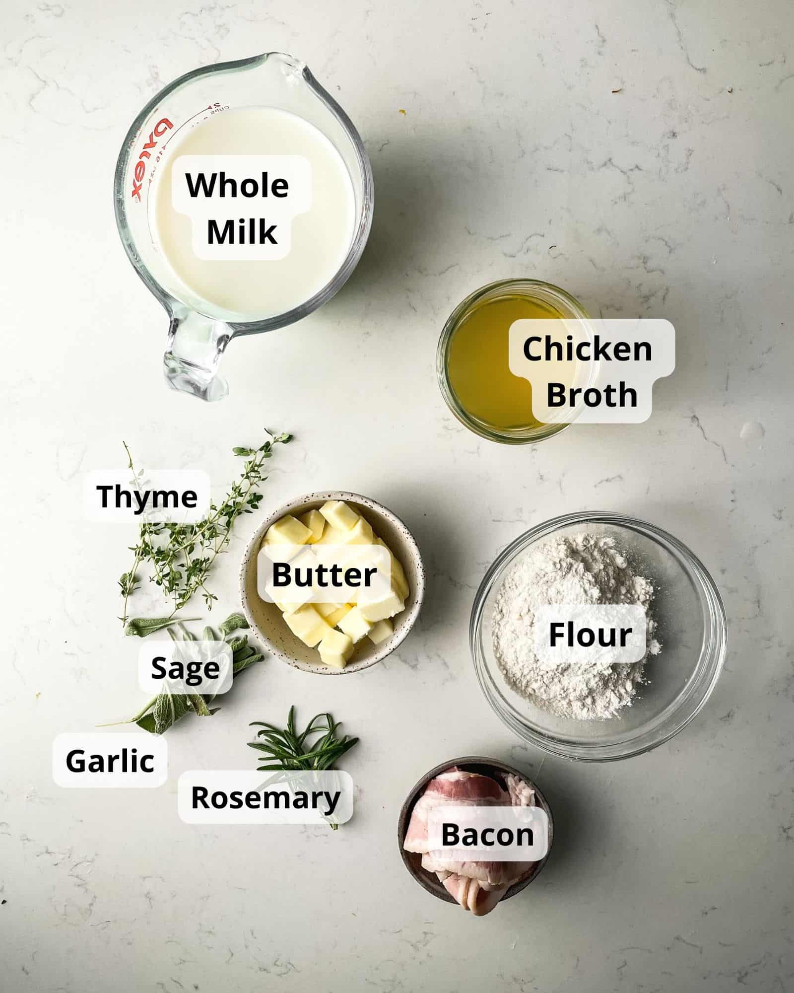 ingredients to make white pepper gravy - bacon, flour, chicken broth, milk, fresh herbs, and butter.