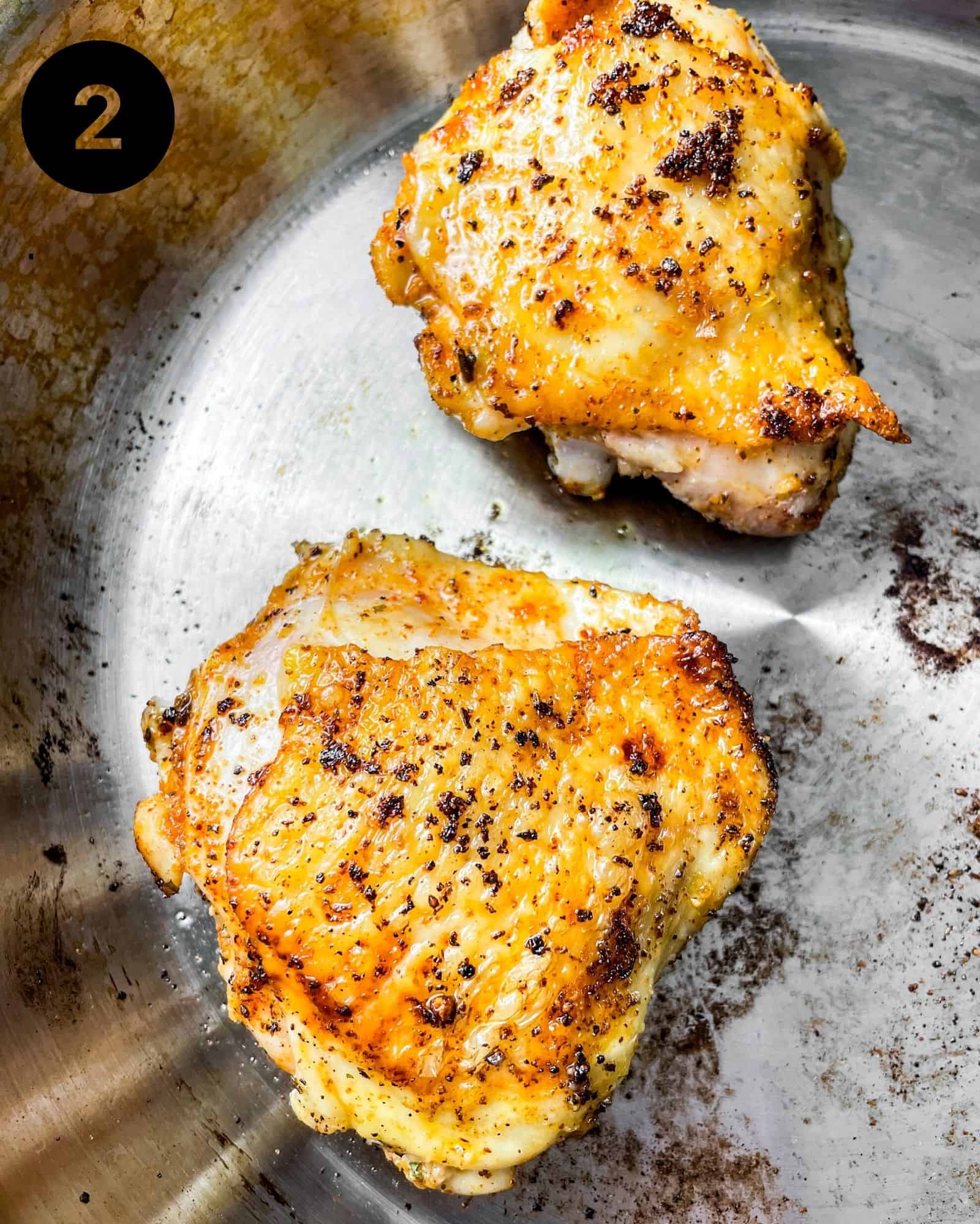 seared chicken in a pan.
