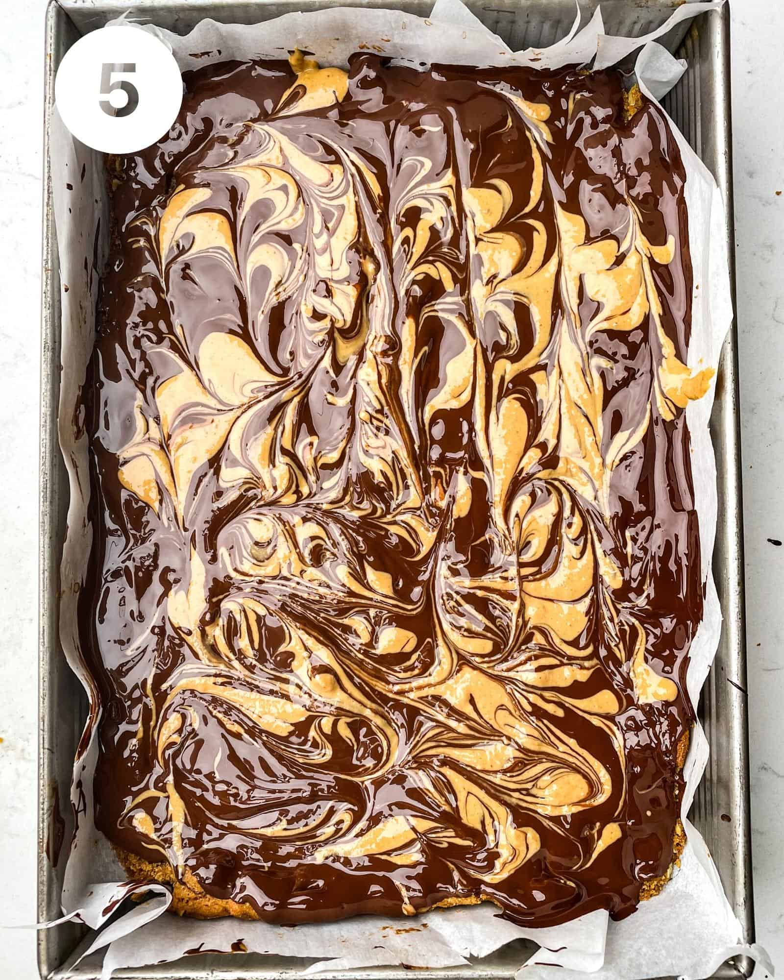 chocolate peanut butter oatmeal bars in a baking pan.