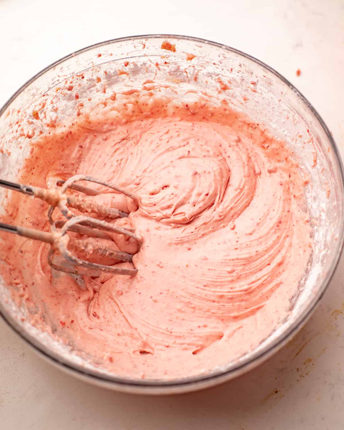 strawberry cream cheese filling mixed together in a large mixing bowl.