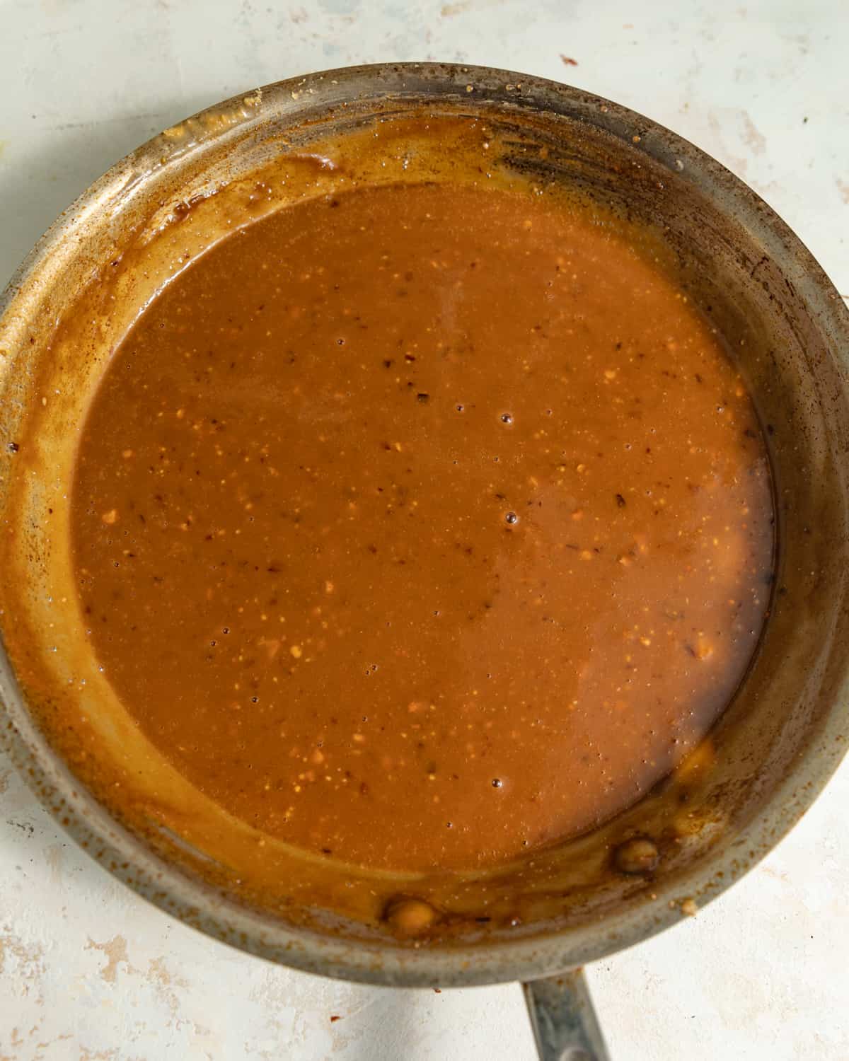 Spicy peanut sauce in a saucepan.