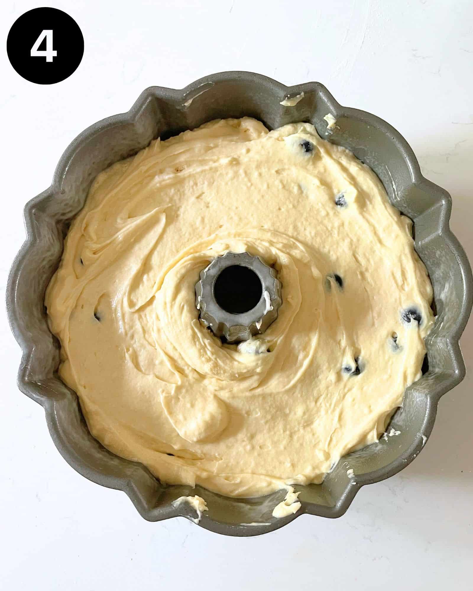 blueberry pound cake batter in a bundt pan.