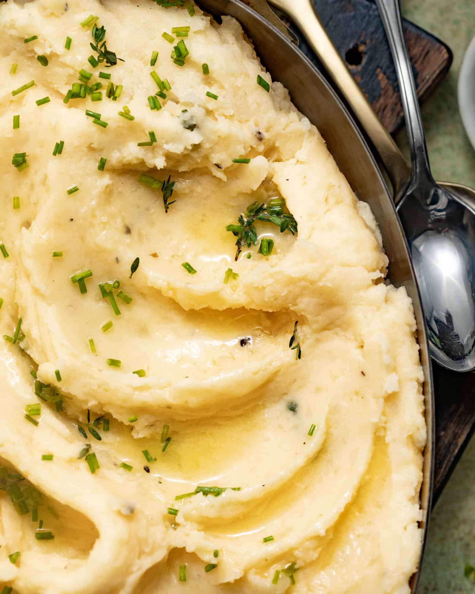 Butter melted over the top of cheesy mashed potatoes.