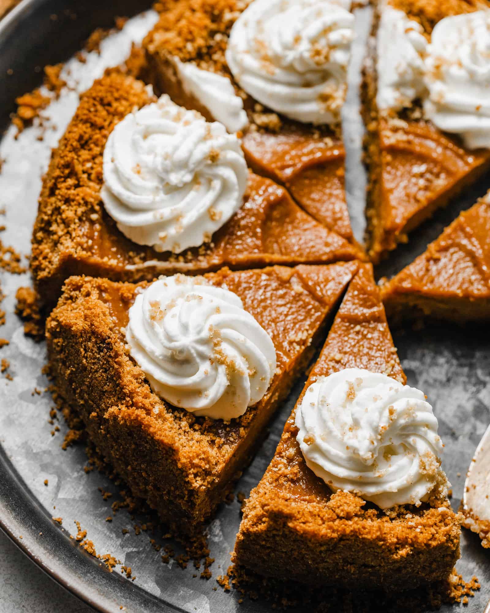 sweet potato pie with graham cracker crust on a silver tray