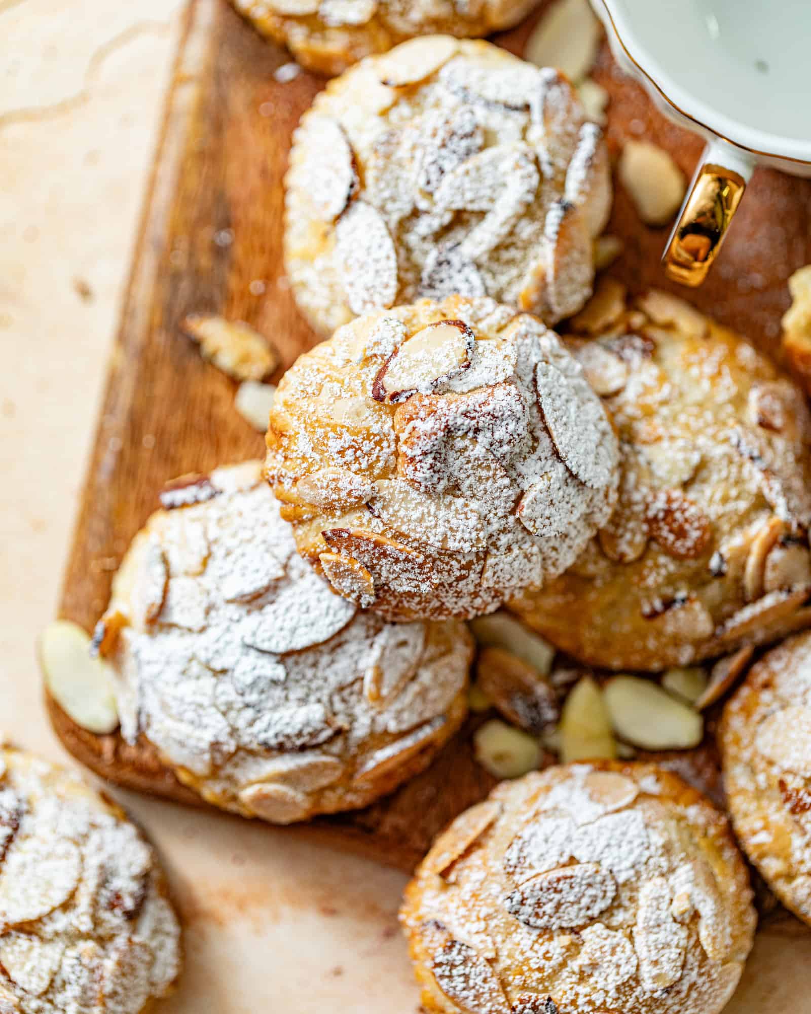 almond croissant cookies on a cutting board.