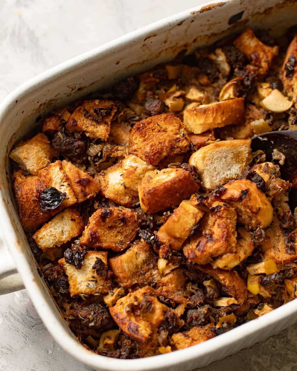 overhead photo of sage and sausage stuffing in a casserole dish.