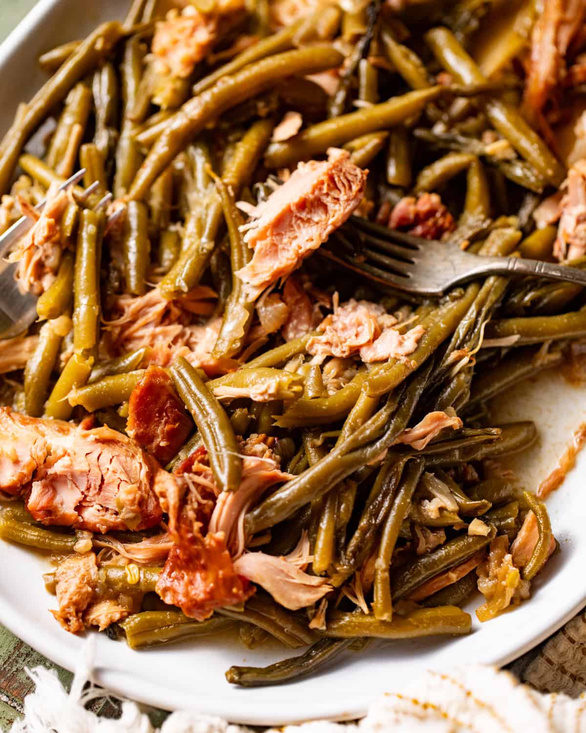 slow cooker green beans on a white serving plate.