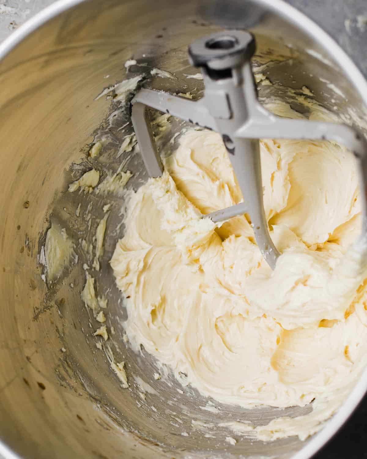 butter and powdered sugar creamed together in the bowl of a stand mixer.