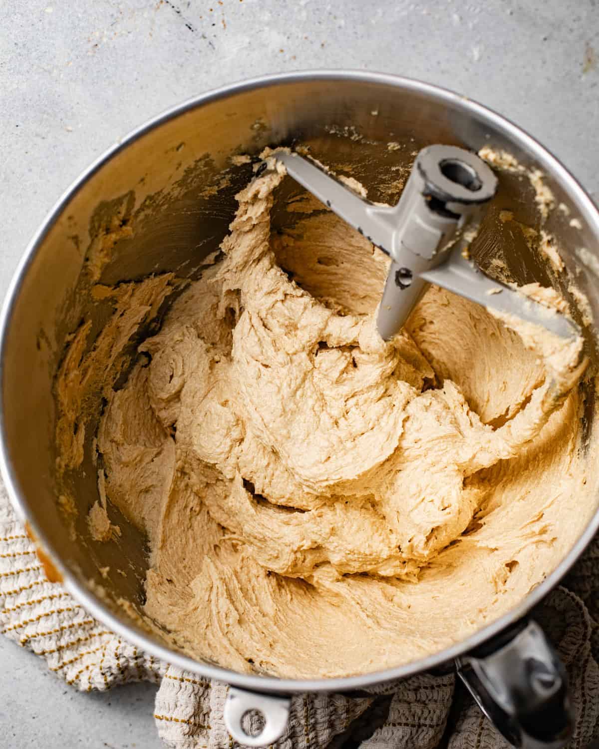 butter and sugar creamed together in a bowl. 