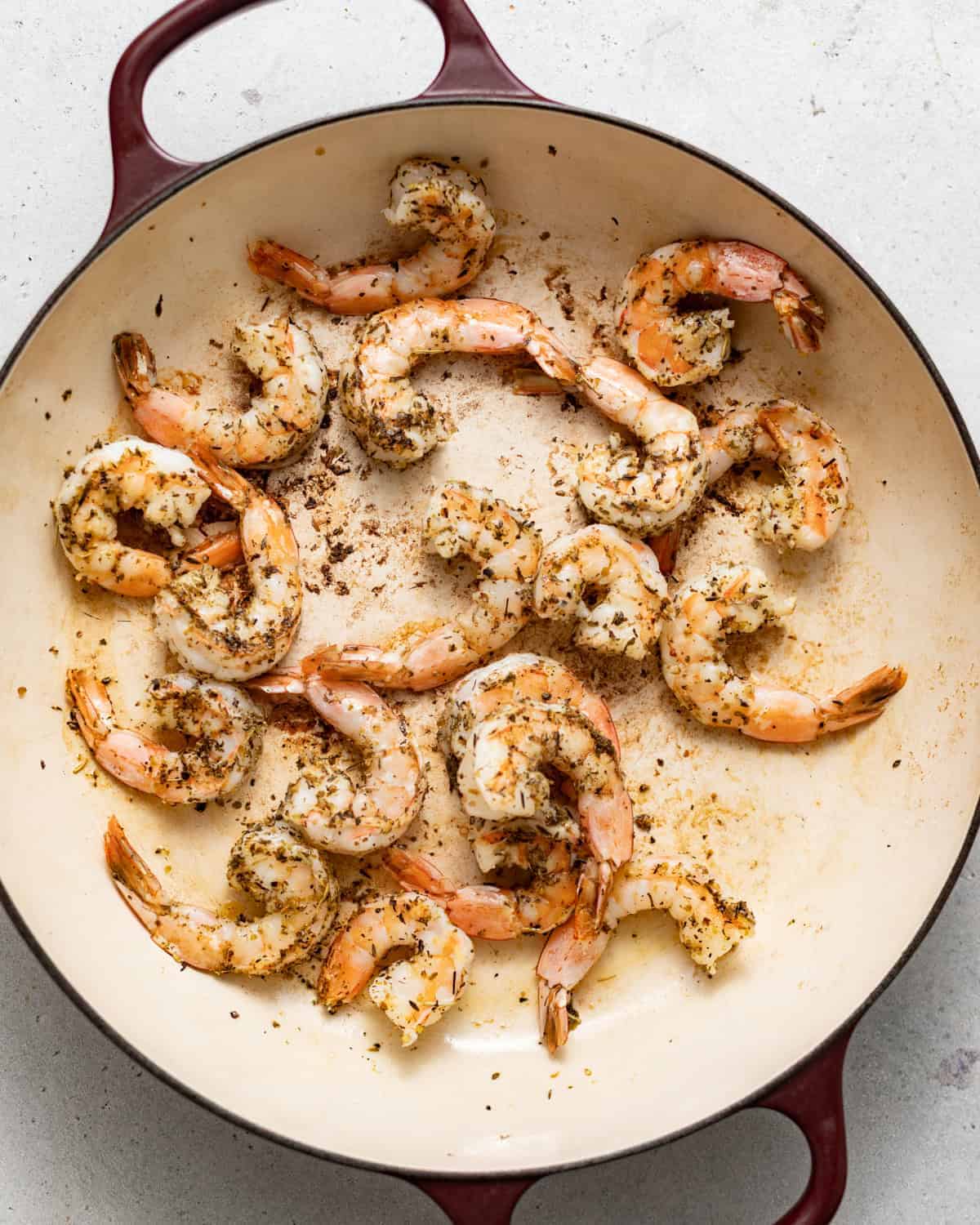 seared shrimp in a skillet.