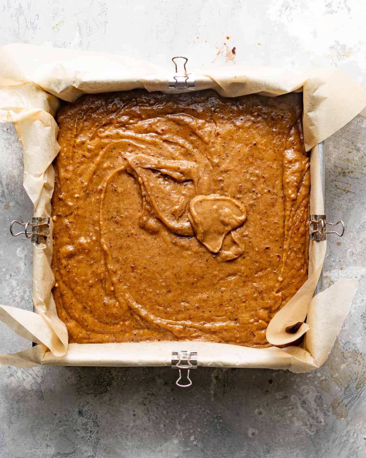 cake batter in a square baking dish. 