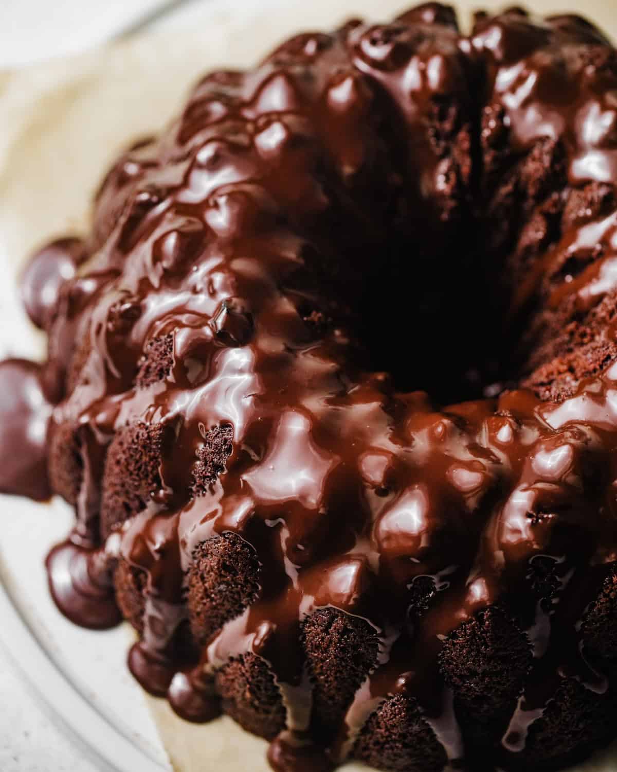 overhead photo of chocolate brownie cake covered in chocolate ganache. 