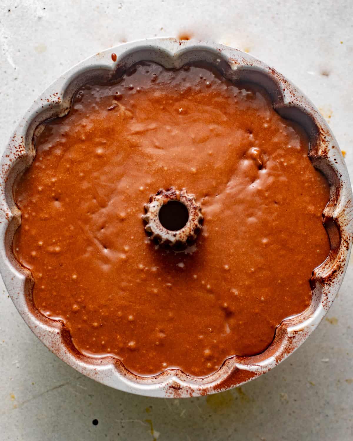 cake batter in a bundt pan. 