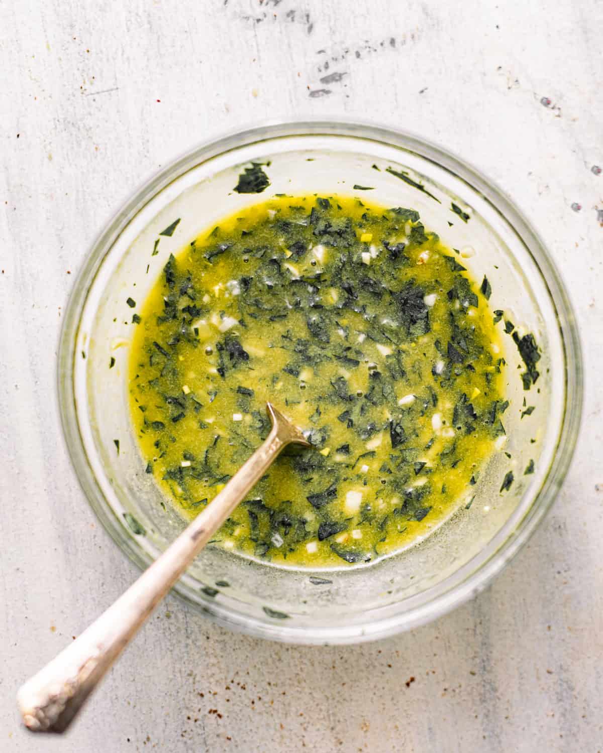 lemon dijon dressing mixed together in a bowl. 