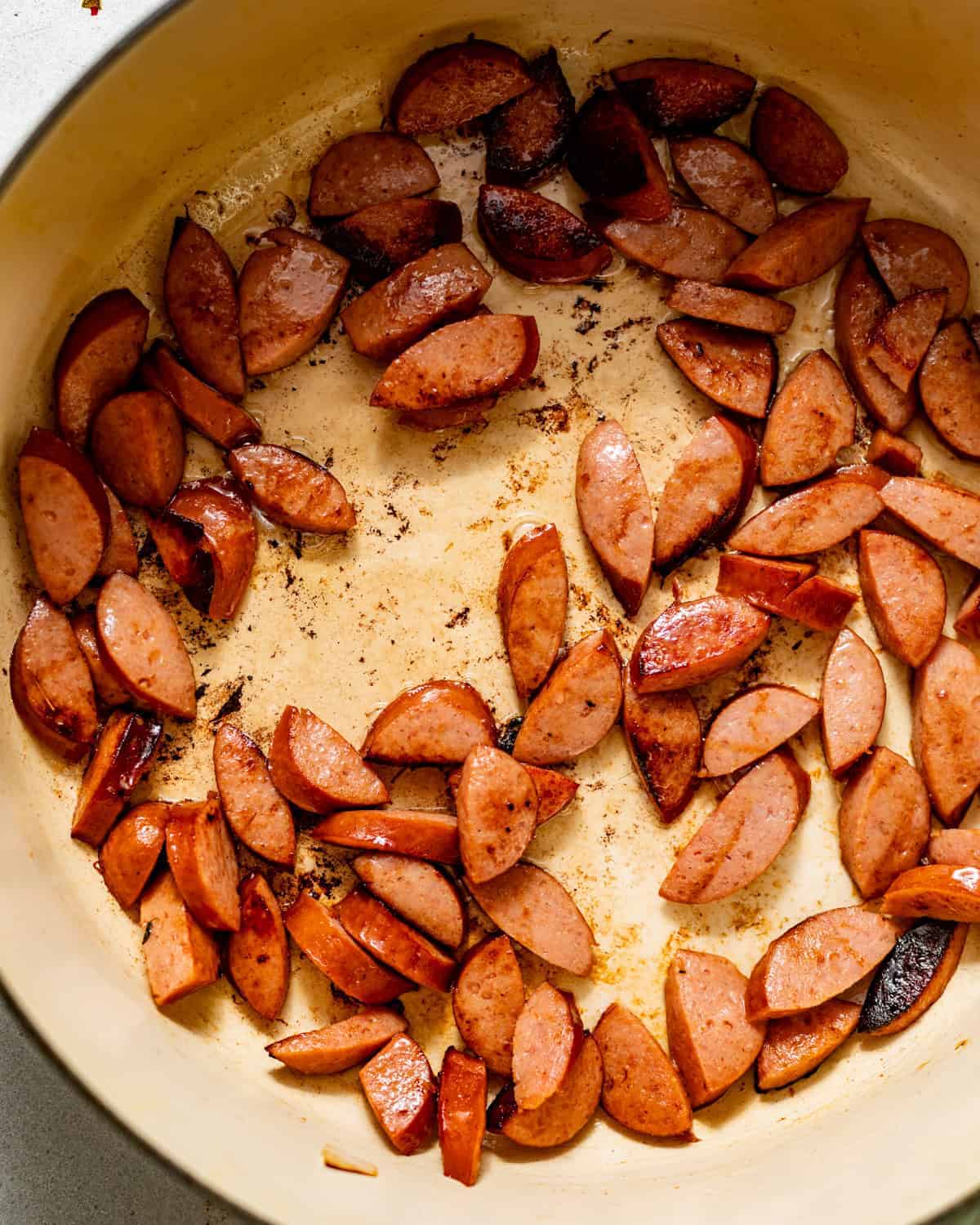 seared sausage in a pot.
