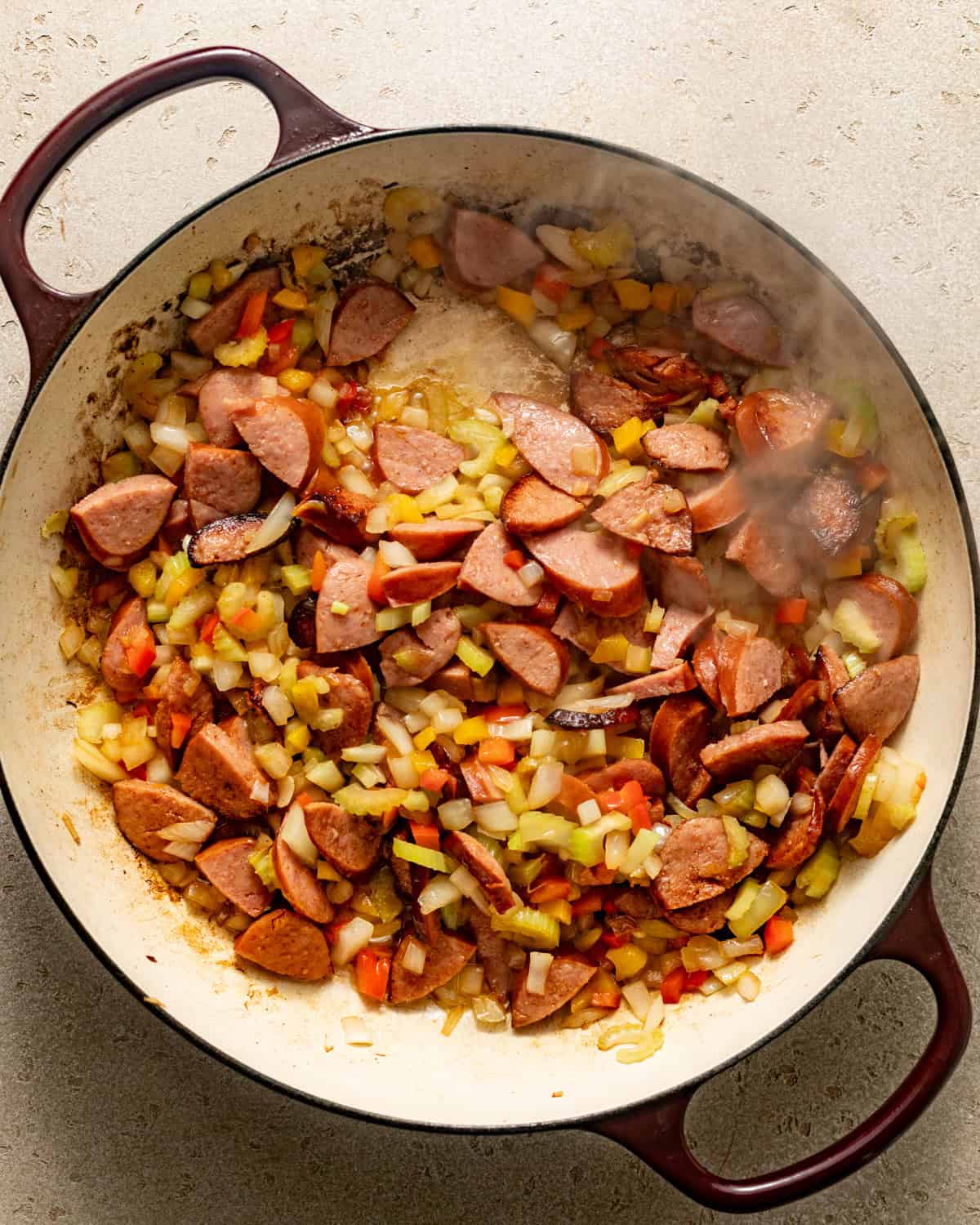 sausage and vegetables cooked in a pot.