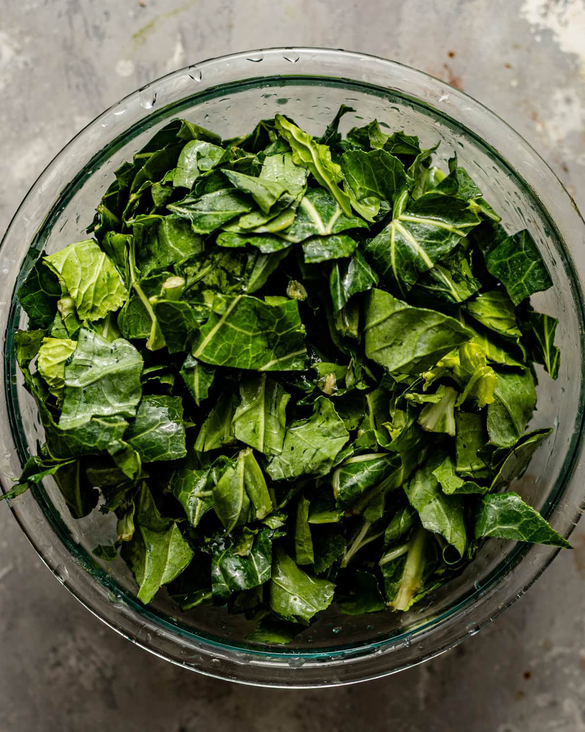 washed and cut collard greens in a large bowl.