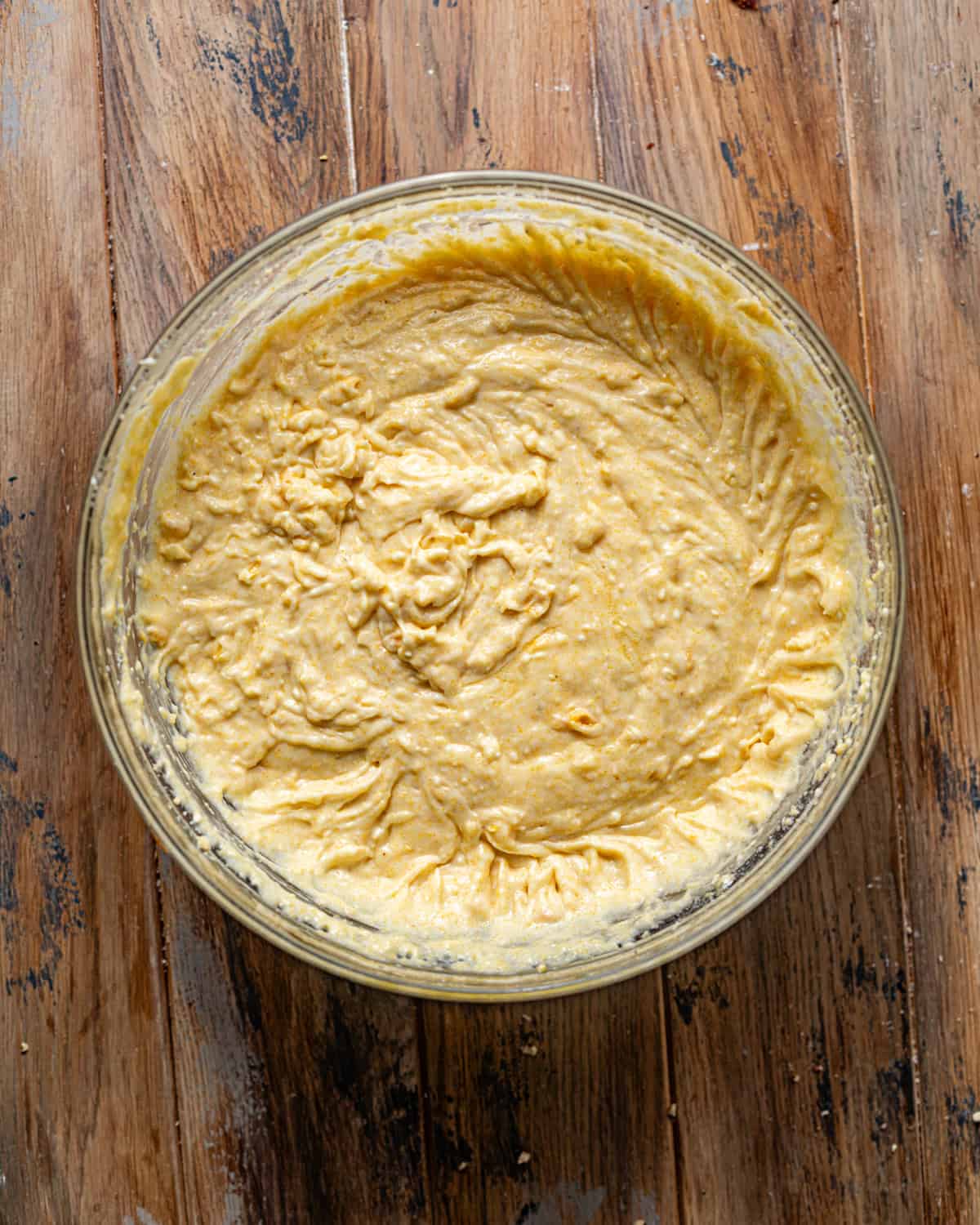 cornbread batter mixed together in a bowl. 