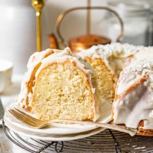 coconut pound cake on a plate with a fork.