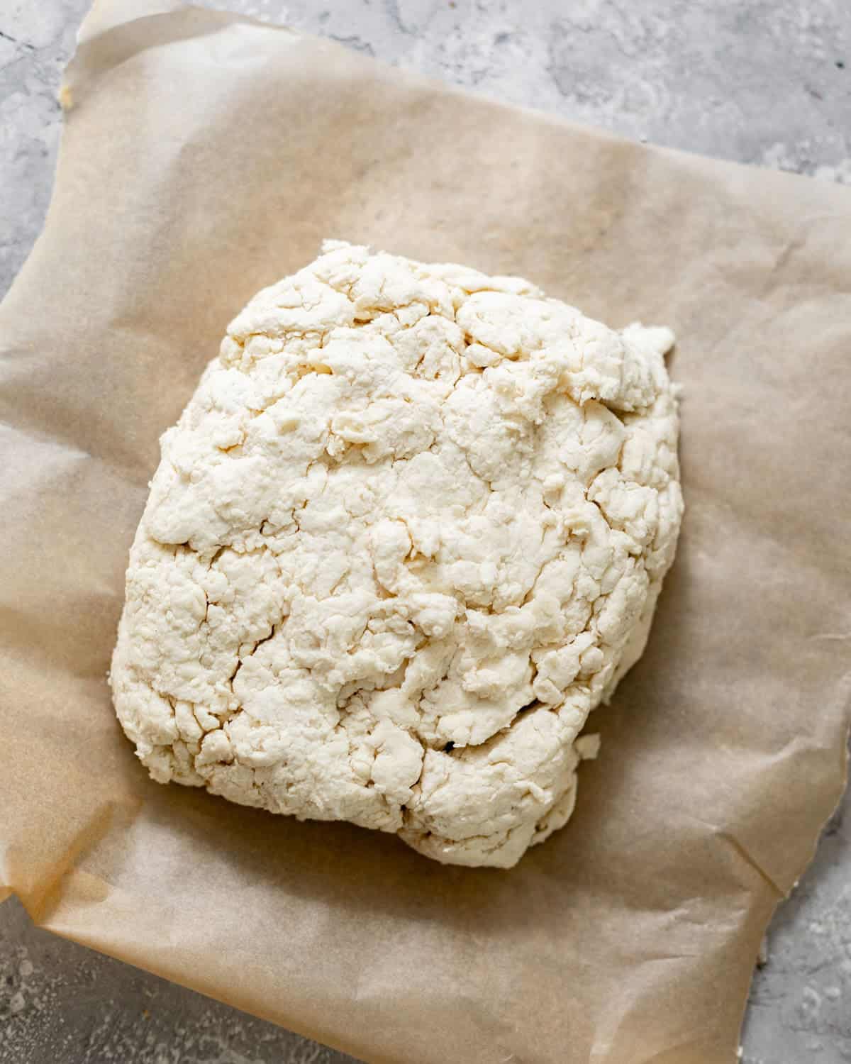 biscuit dough on a piece of parchment paper.