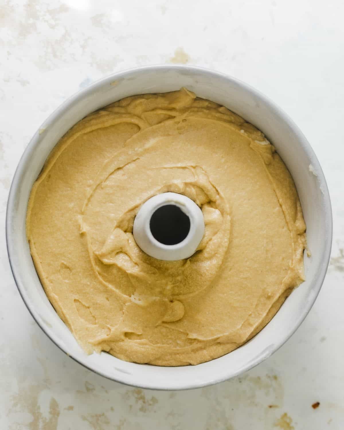 pound cake batter in a tube pan. 