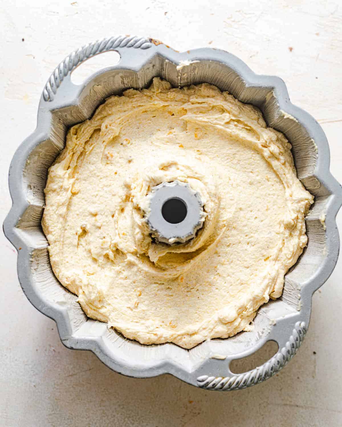 coconut pound cake batter in a bundt pan. 