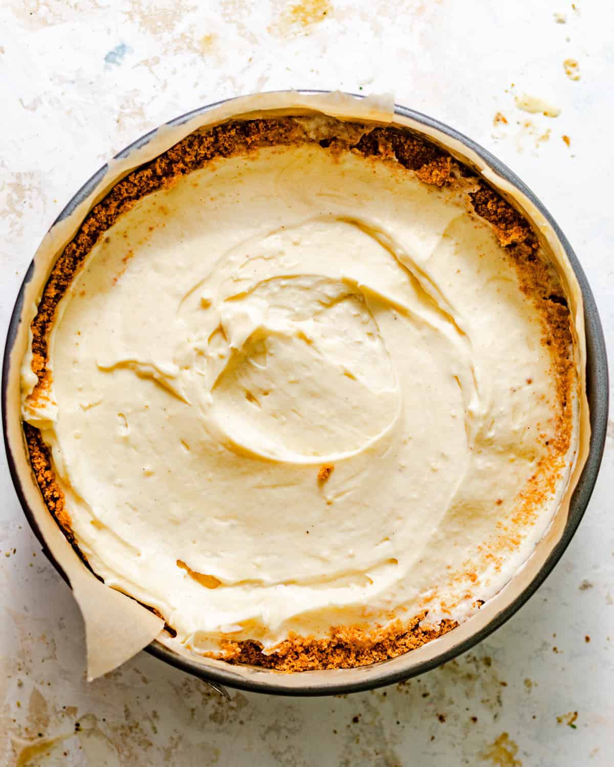 banana cream pie in a springform pan with the remaining filling added on top to cover the bananas.