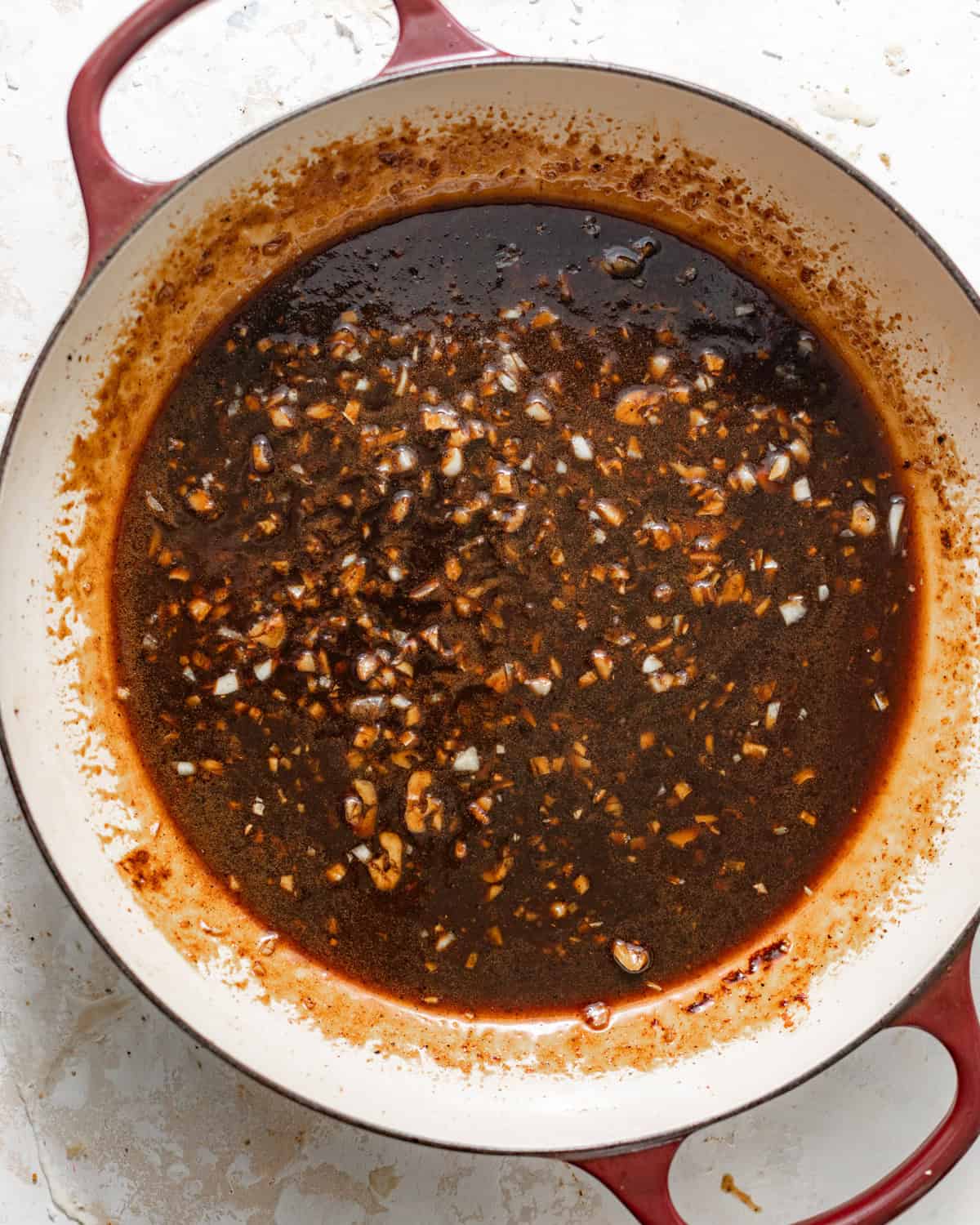 honey garlic sauce cooked in a pan until slightly thickened.