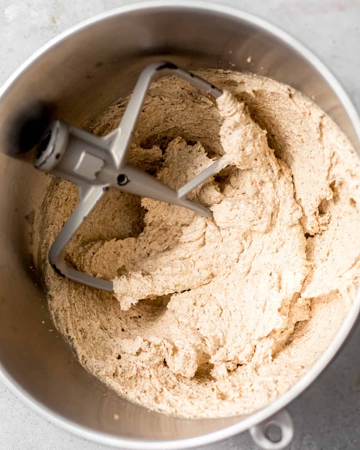 browned butter and regular salted butter, sugar, brown sugar, and vegetable oil creamed together in the bowl of a stand mixer until pale and fluffy.