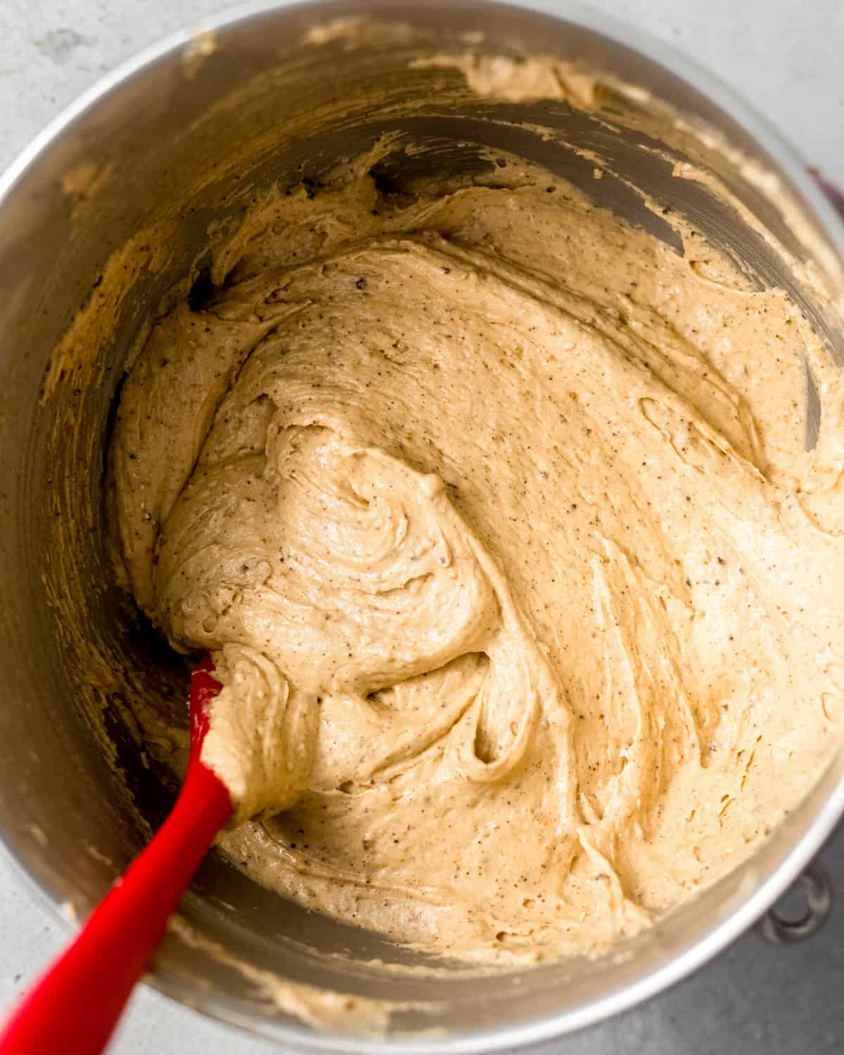 smooth peanut butter pound cake batter in a stand mixer bowl. 