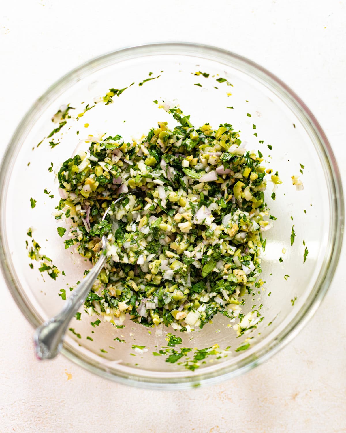 olive salsa mixed together in a bowl. 