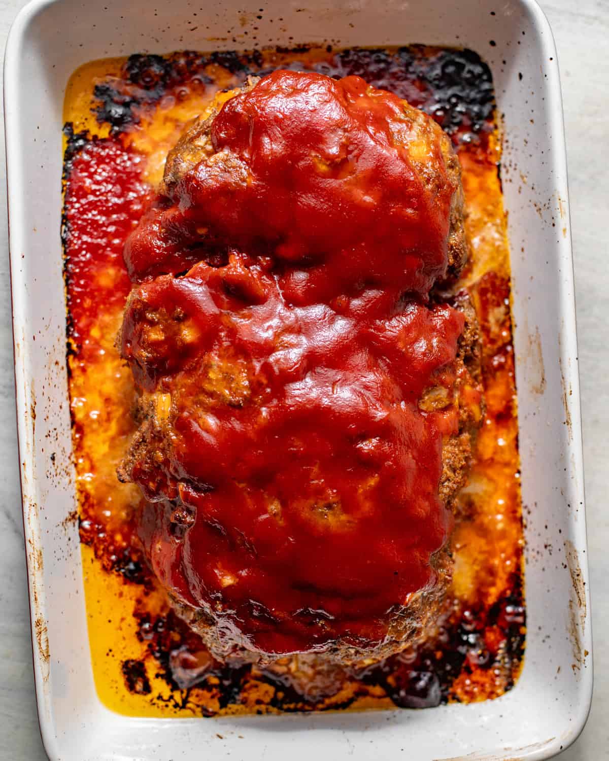baked meatloaf coated in a homemade bbq glaze.