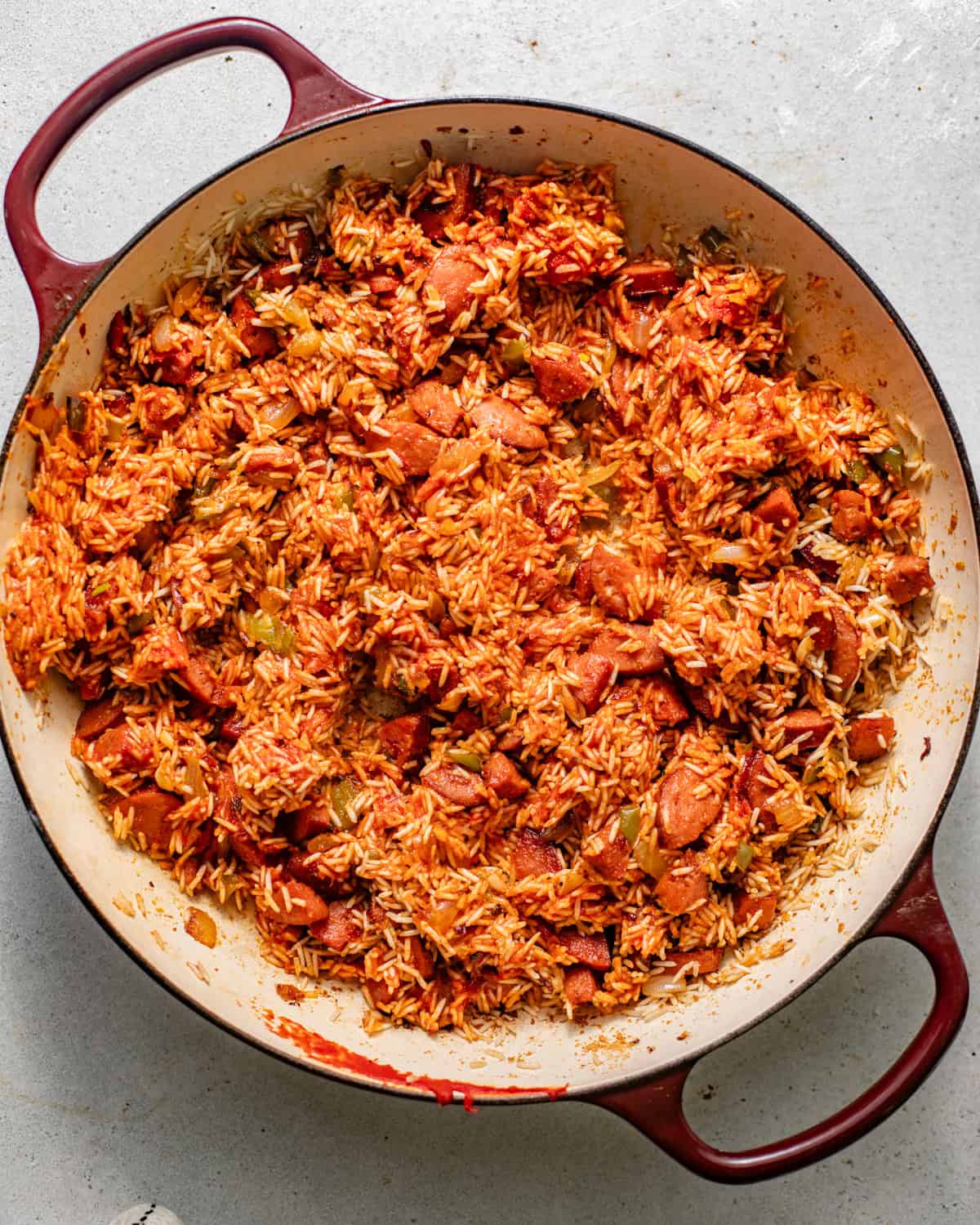 rice added to cooked sausage and vegetables to toast the rice before adding the liquids.