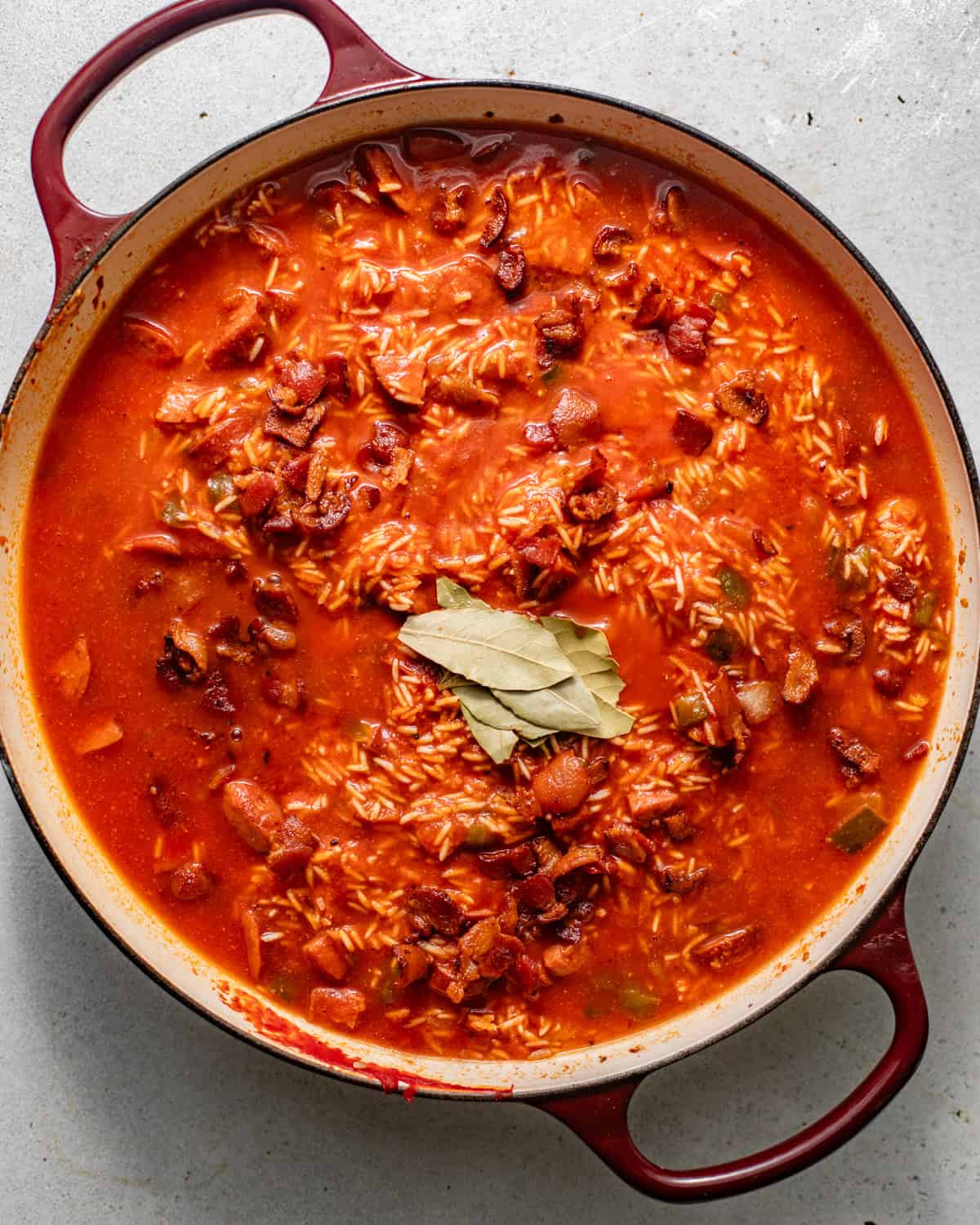 chicken broth and tomato sauce added to the rice mixture before baking.