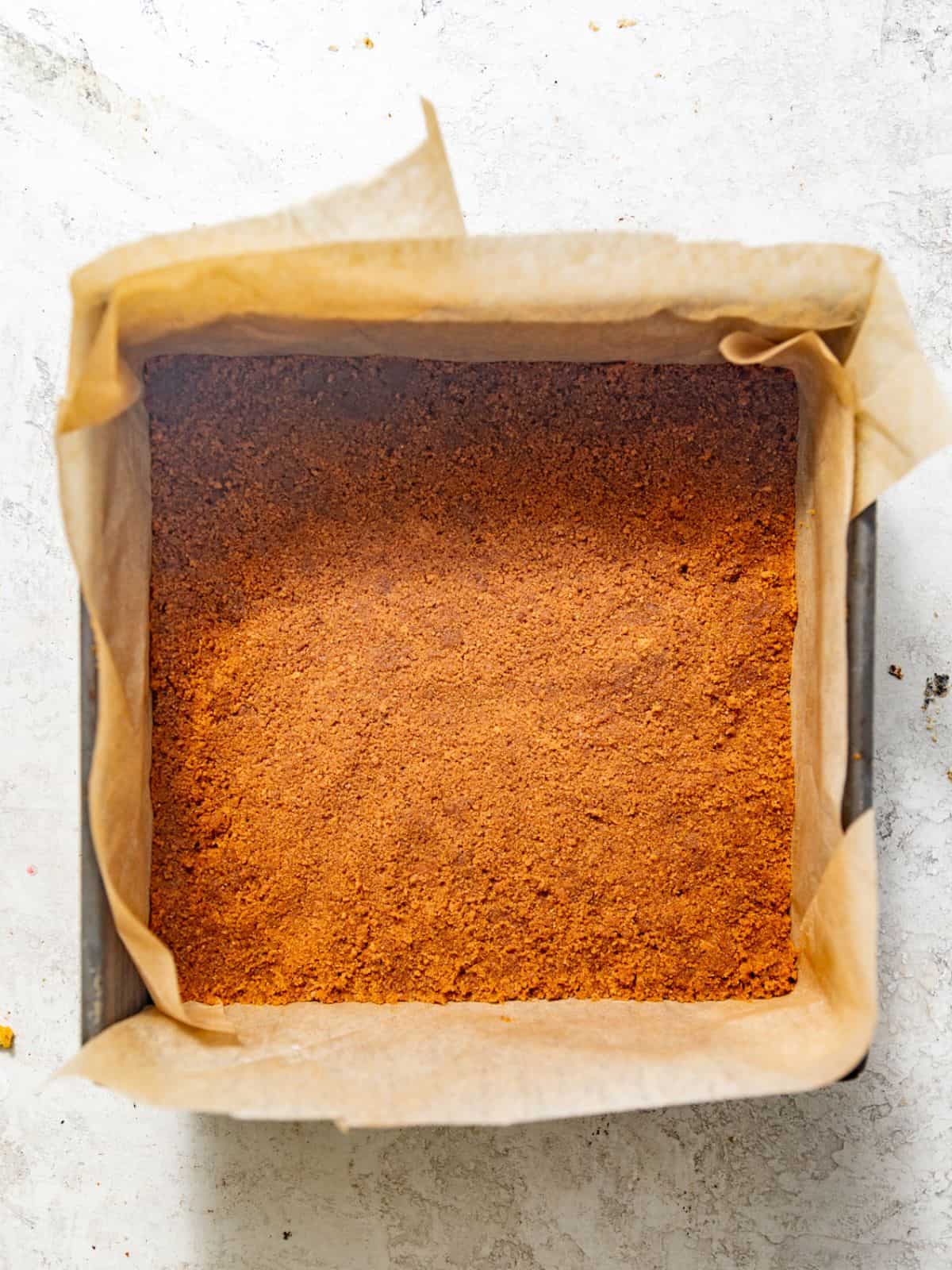graham cracker crust firmly pressed into a square baking pan. 