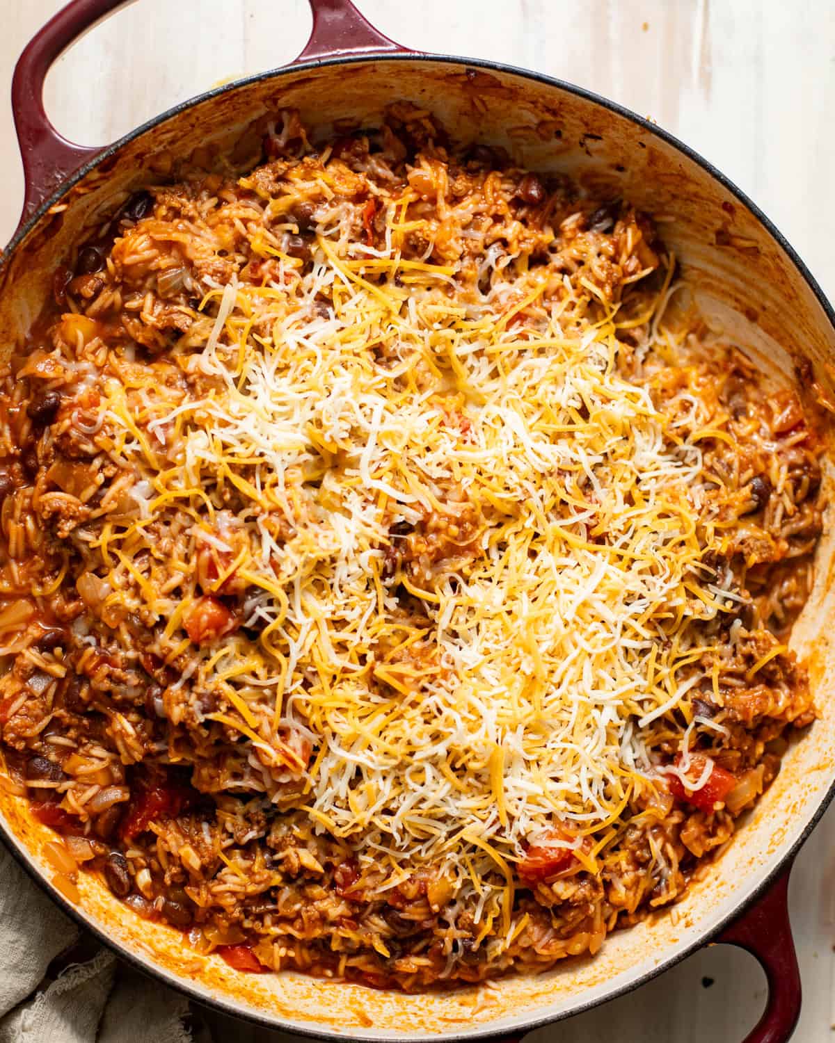 cooked taco rice with melted cheese on top. 