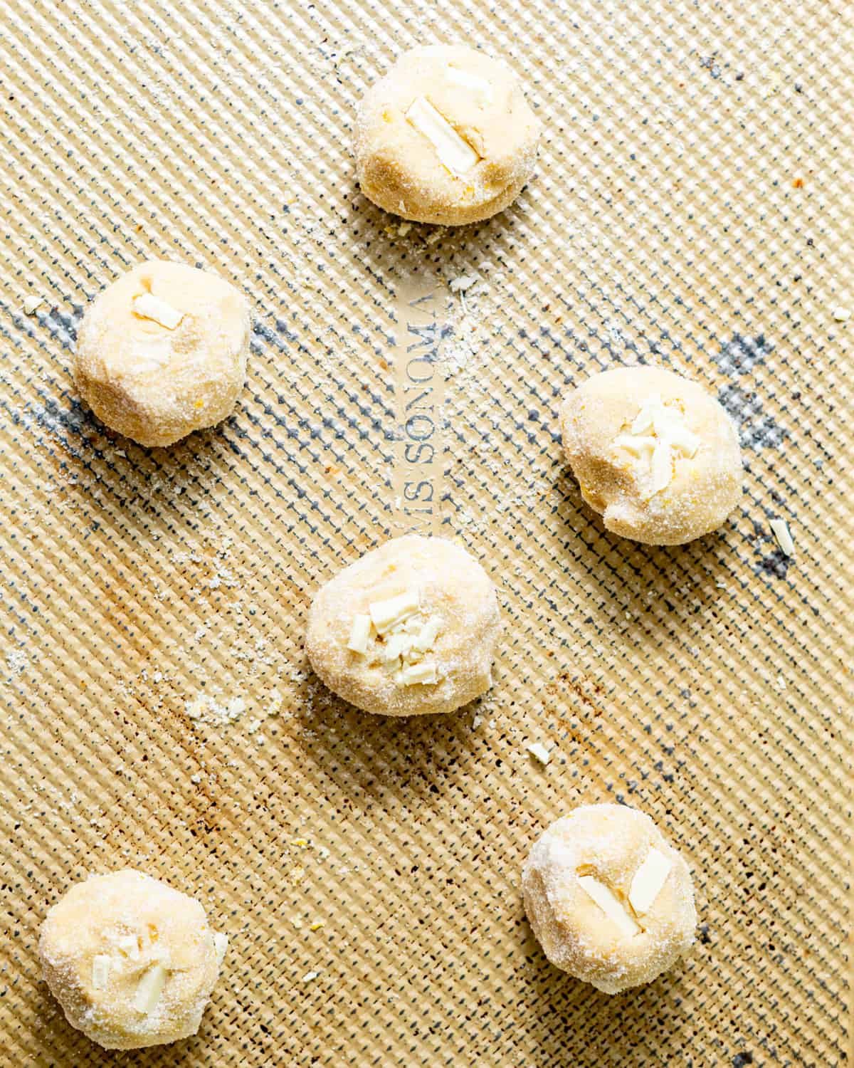 cookies on a baking sheet spaced out before baking.
