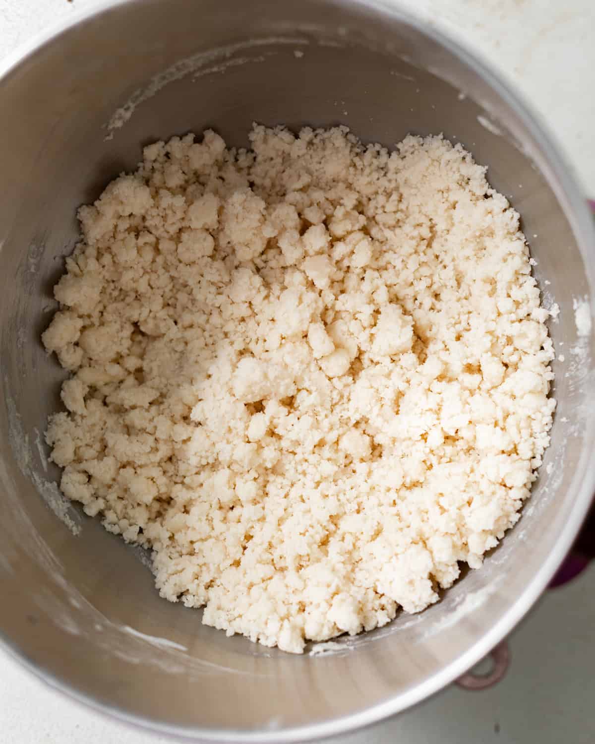 Butter mixed with the dry ingredients until sandy and crumbly for reverse creaming method.