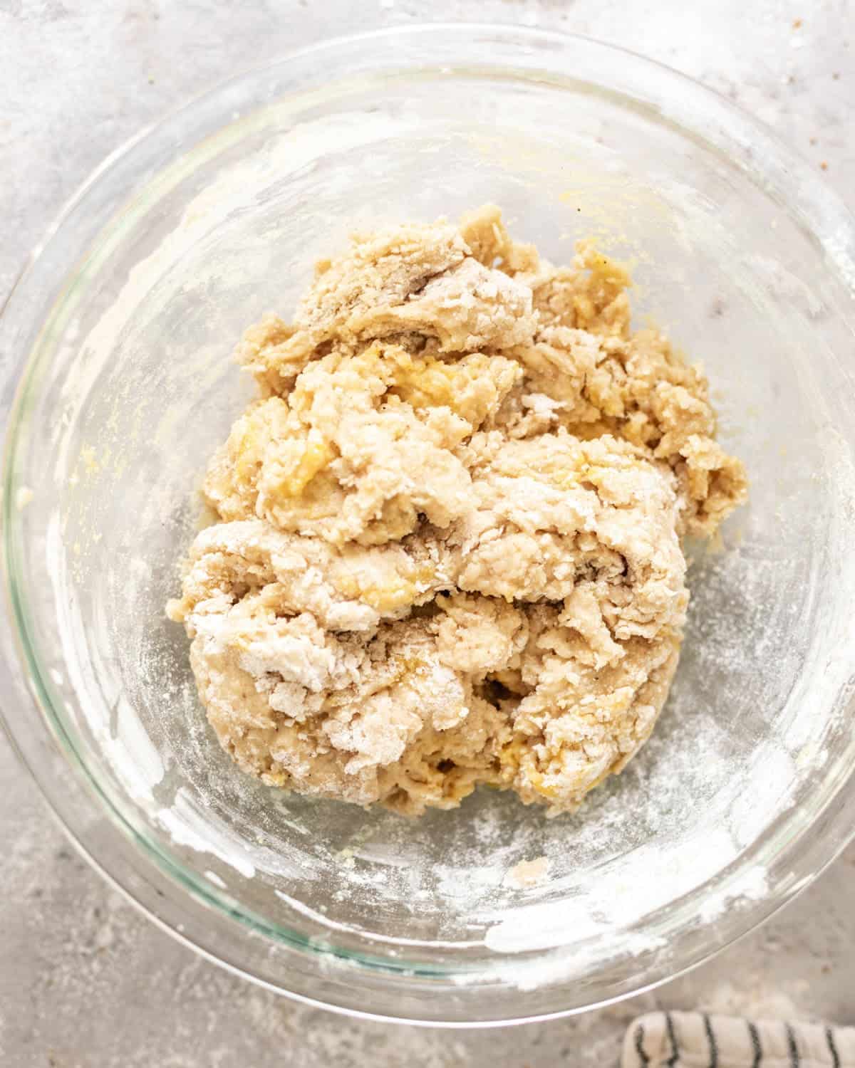 shaggy dough mixed together in a mixing bowl before adding butter.