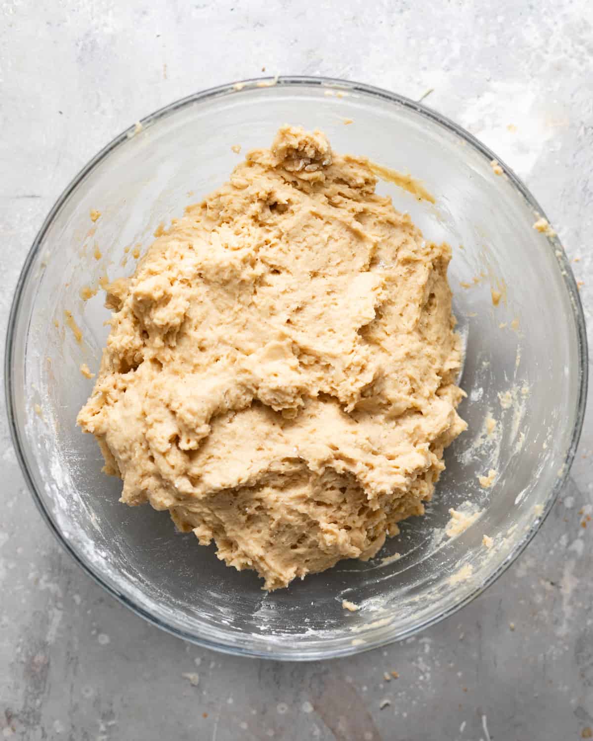 maple donut dough mixed together in a bowl.