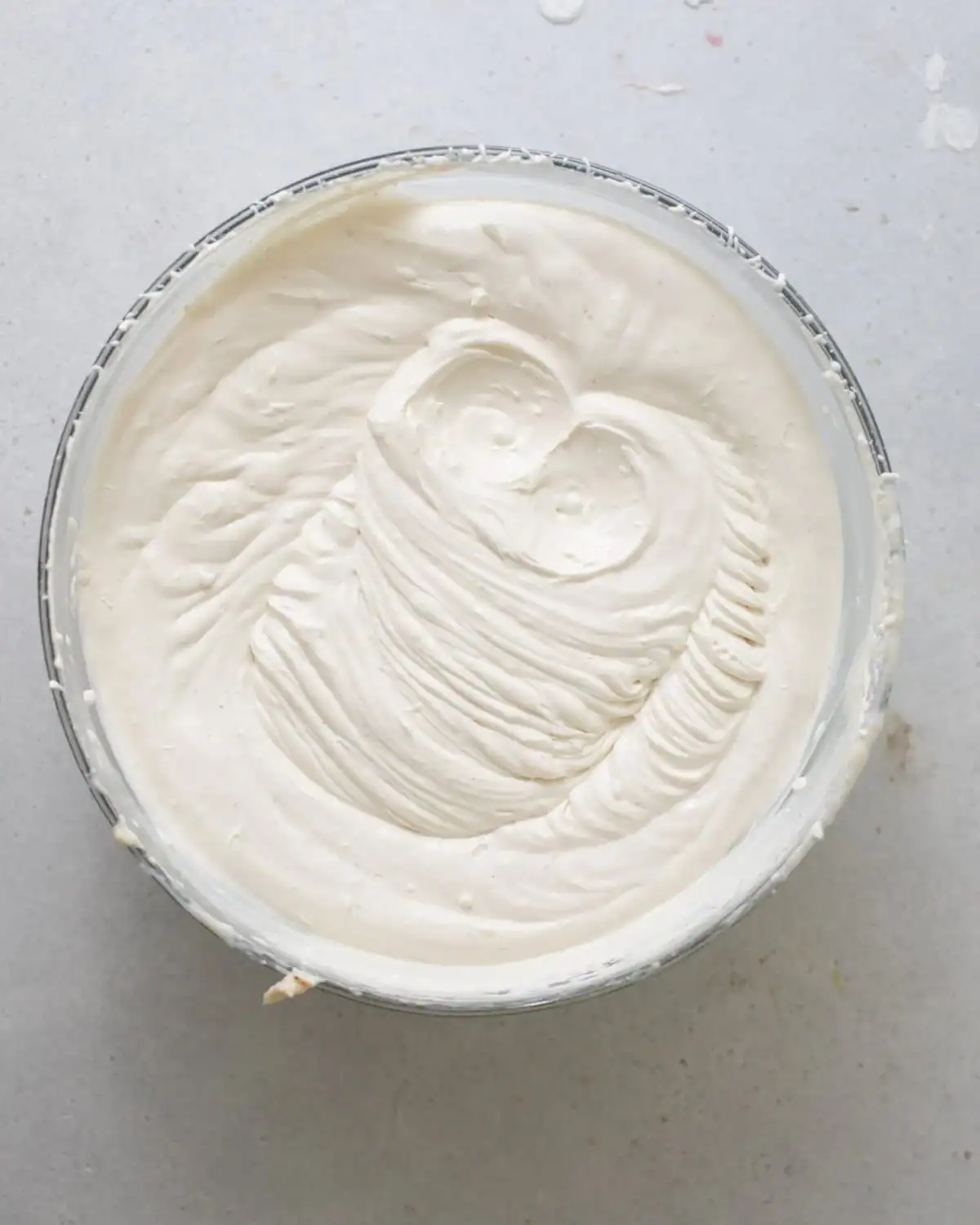 whipped cream whipped in a bowl until stiff peaks.