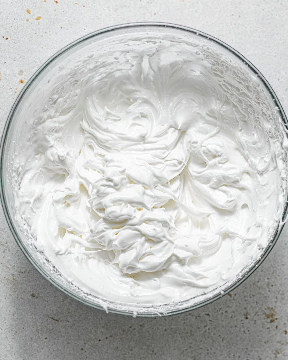 whipped egg whites until stiff peaks in a bowl.
