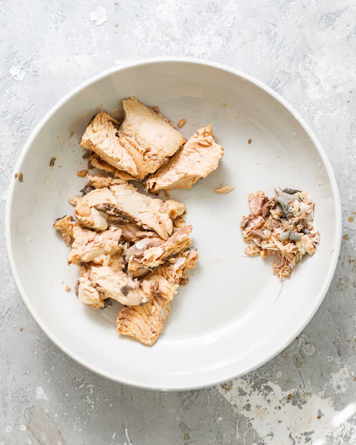 Drained canned salmon with the bones and skin removed and placed to the side.