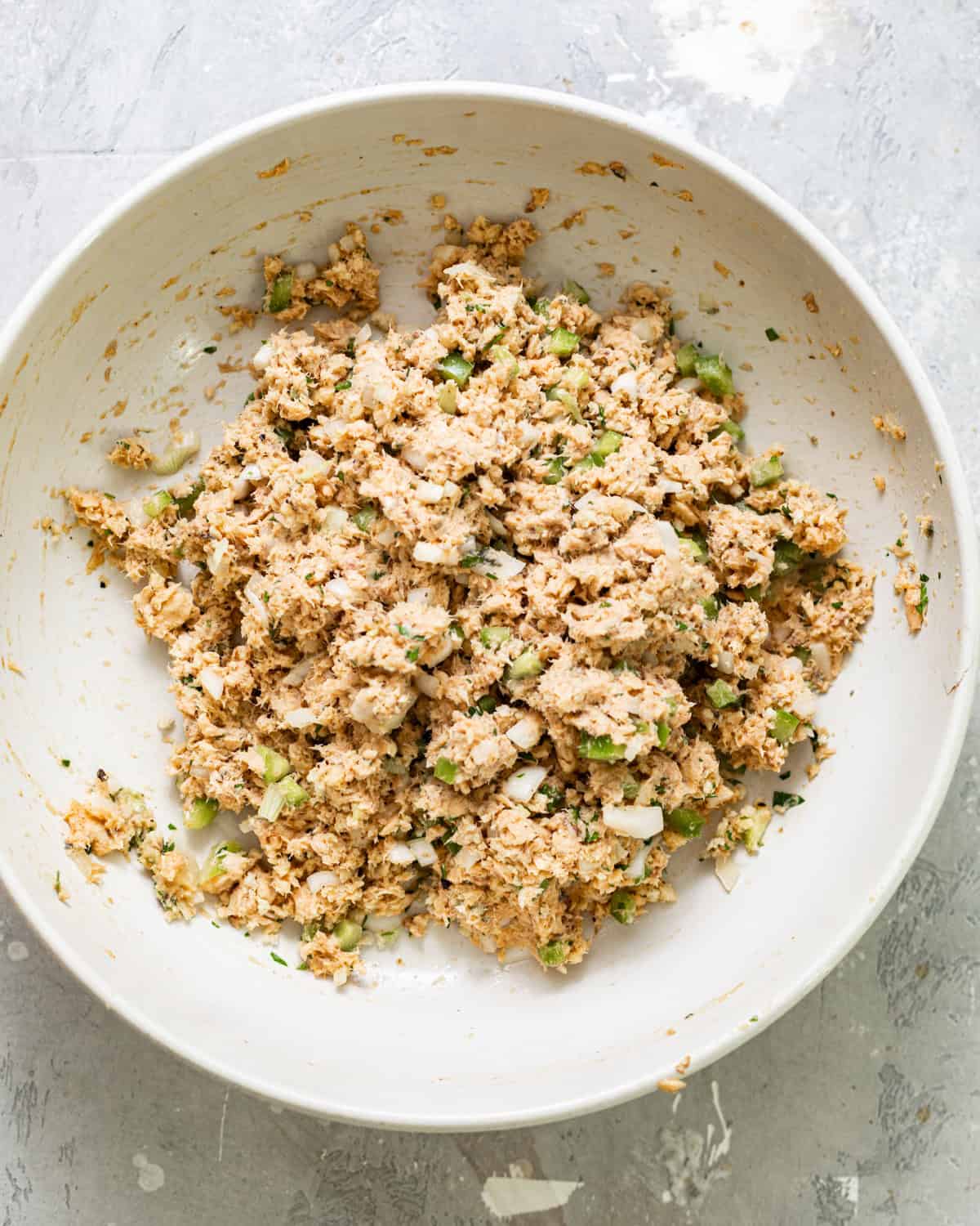 Salmon croquette mixture combined with diced green bell pepper, onion, and fresh parsley.