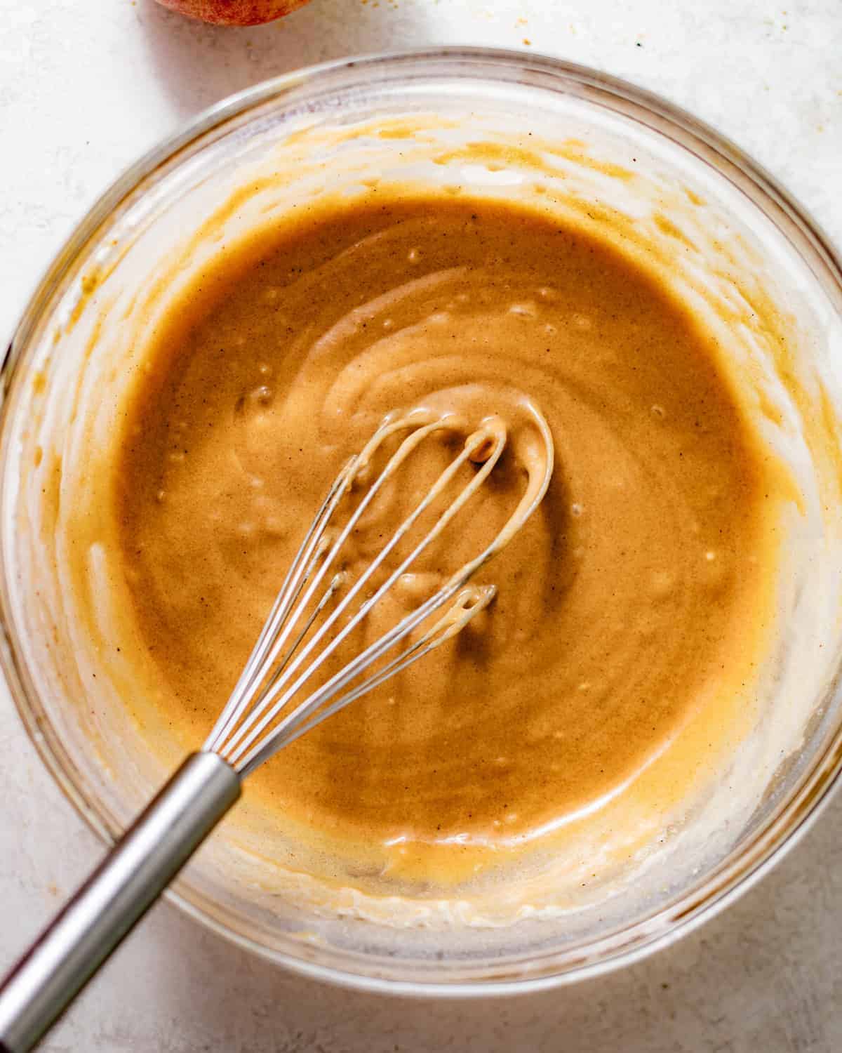 cake batter whisked together in a bowl. 