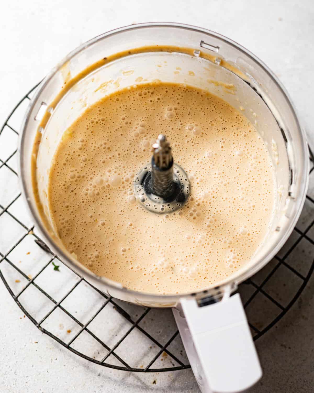 she crab soup poured into a food processor and blended until smooth.